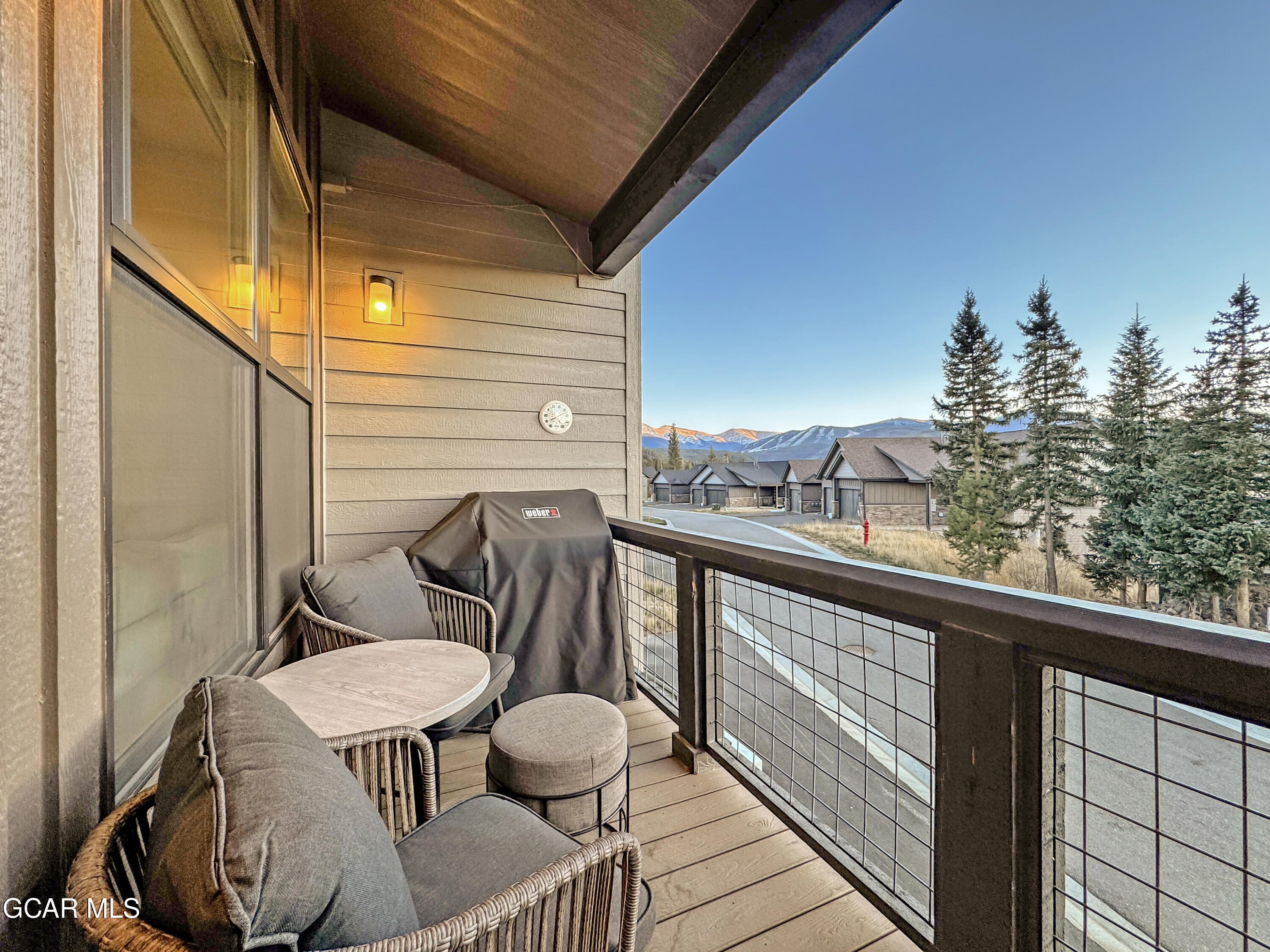 166 Homestead Loop Fraser, CO 80442 - Photo 14 of 56 a view of balcony with wooden floor and outdoor seating
