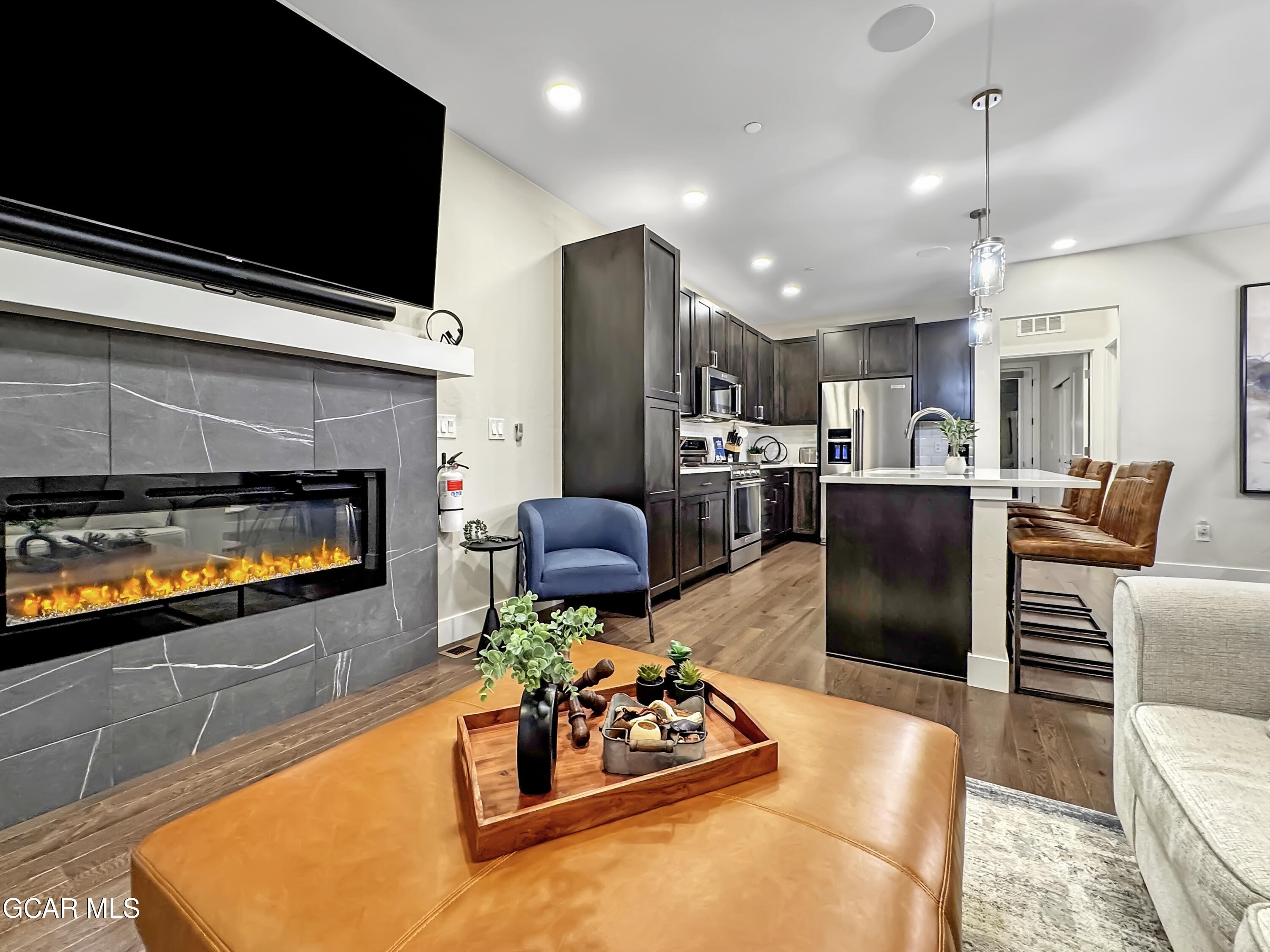 166 Homestead Loop Fraser, CO 80442 - Photo 17 of 56 a living room with stainless steel appliances furniture fireplace and flat screen tv