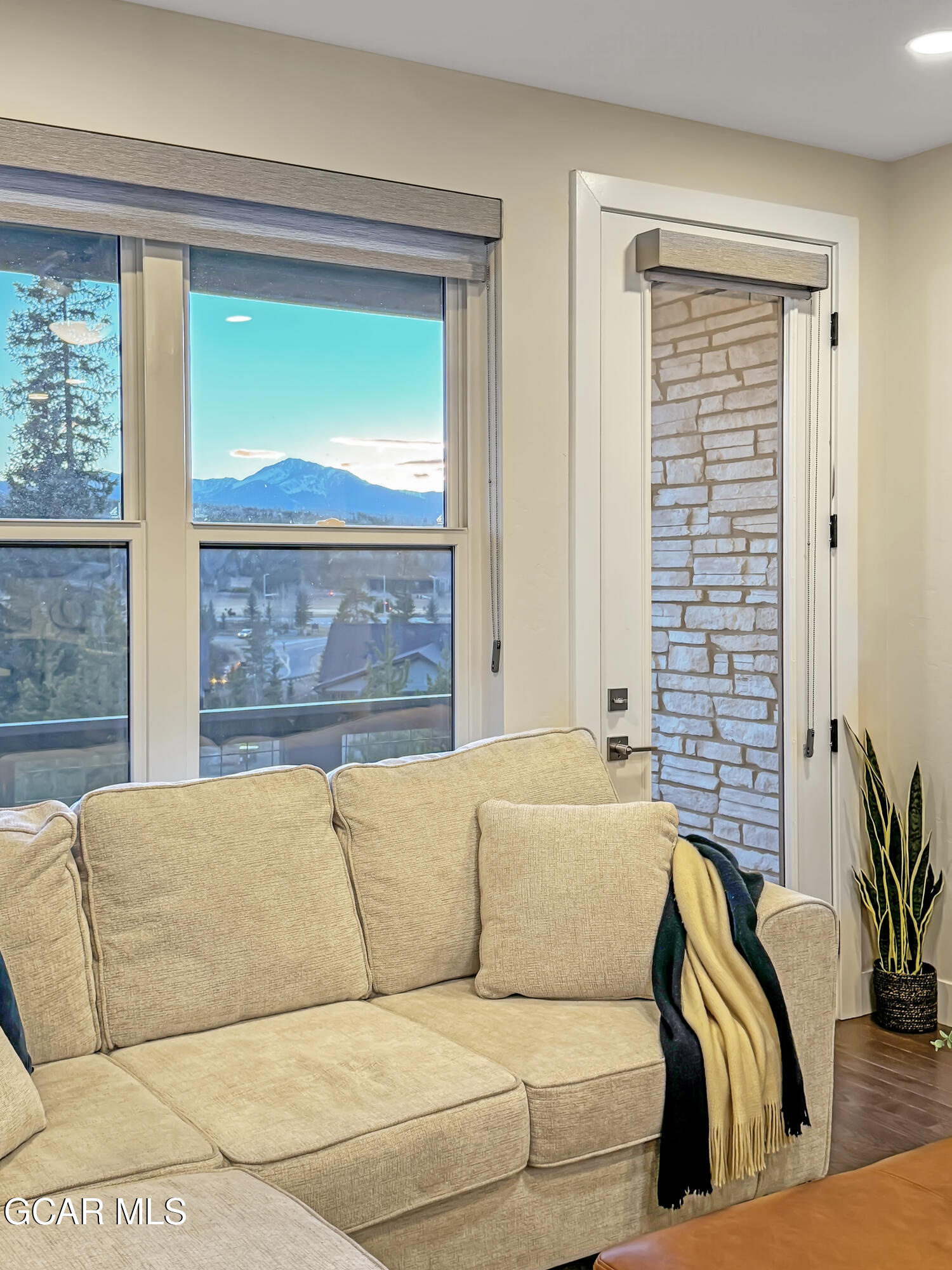 166 Homestead Loop Fraser, CO 80442 - Photo 18 of 56 a living room with a couch and a large window