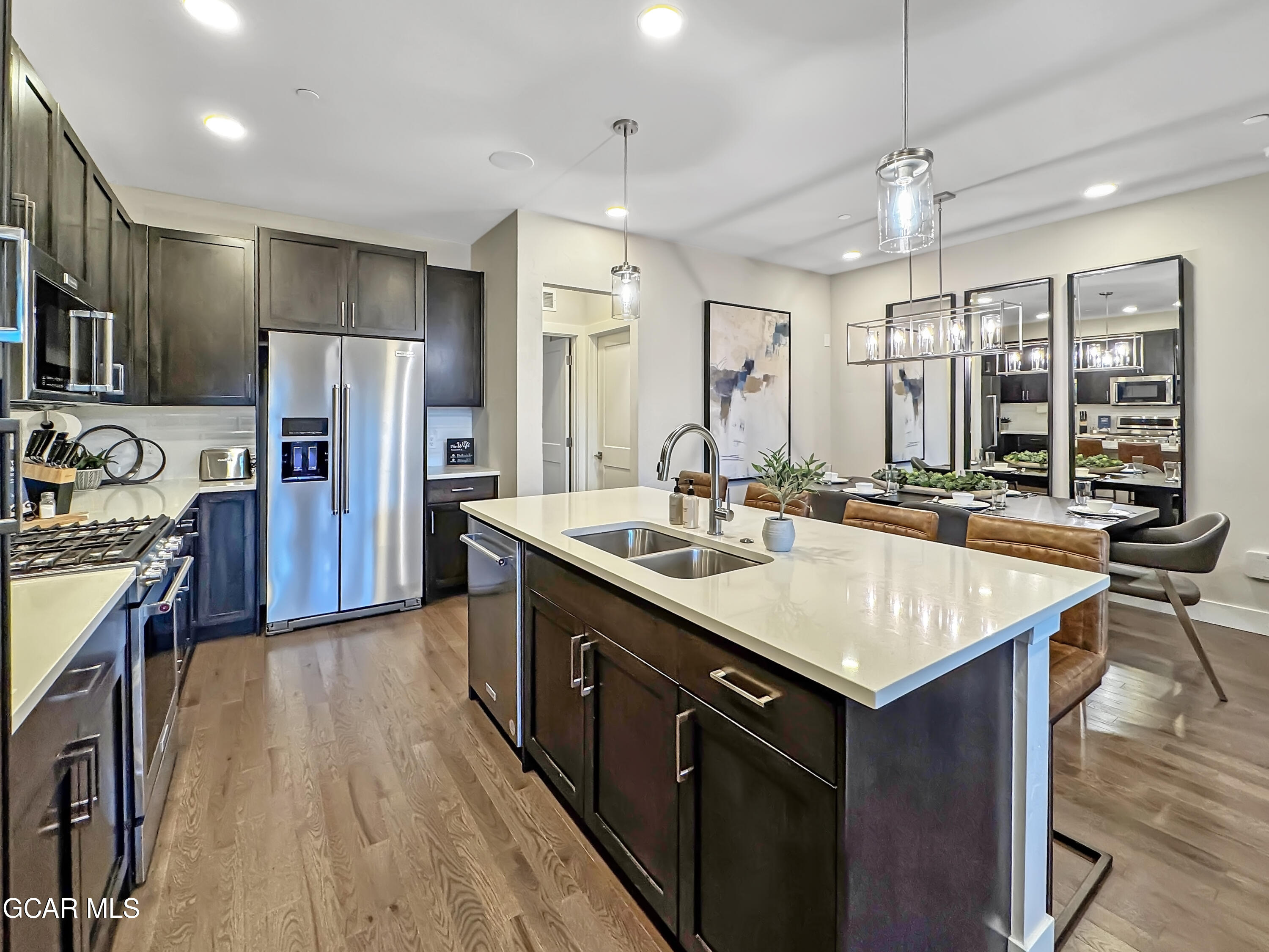 166 Homestead Loop Fraser, CO 80442 - Photo 20 of 56 a kitchen with stainless steel appliances a sink stove and refrigerator