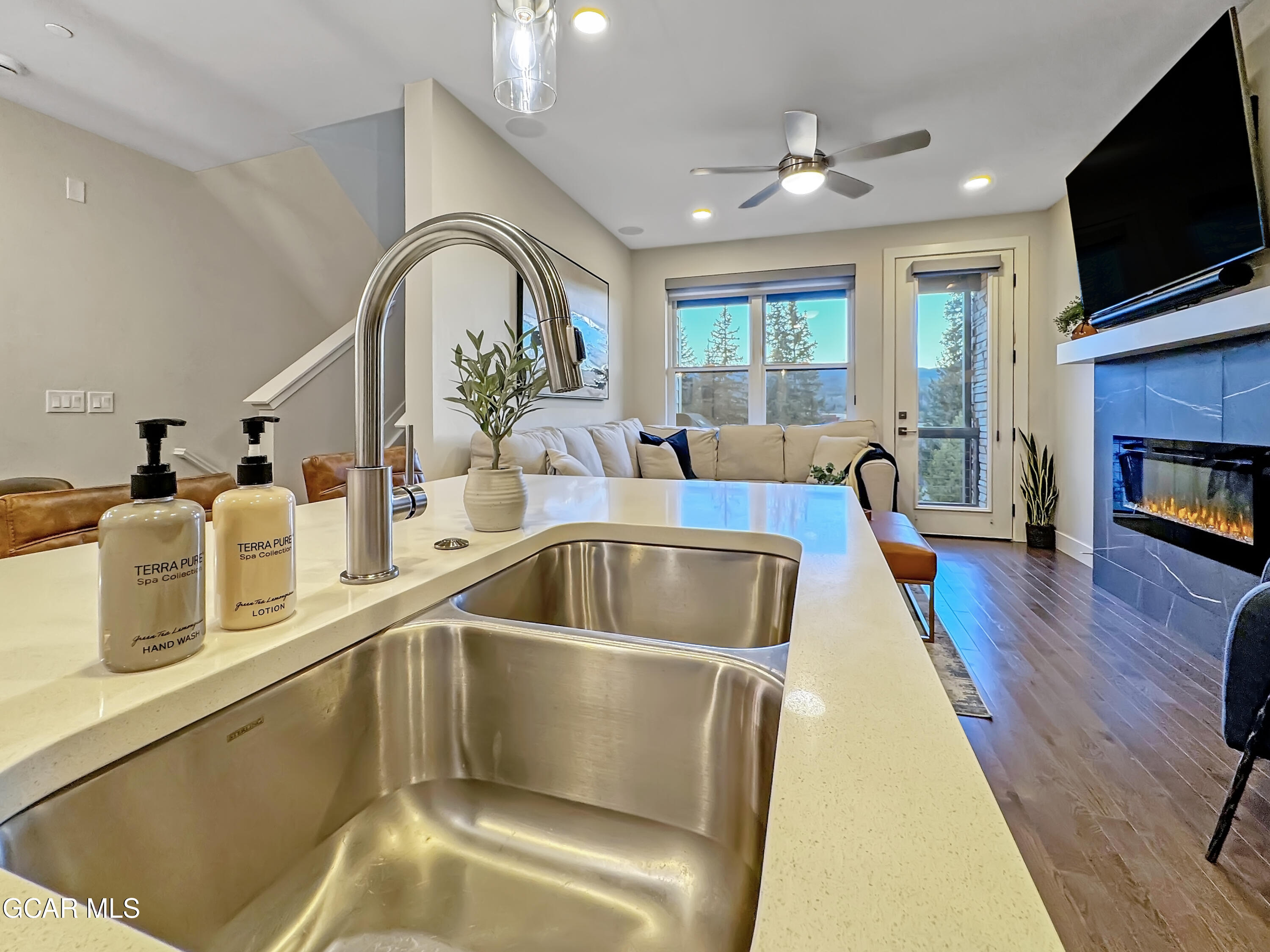 166 Homestead Loop Fraser, CO 80442 - Photo 22 of 56 a living room with fireplace furniture and a flat screen tv