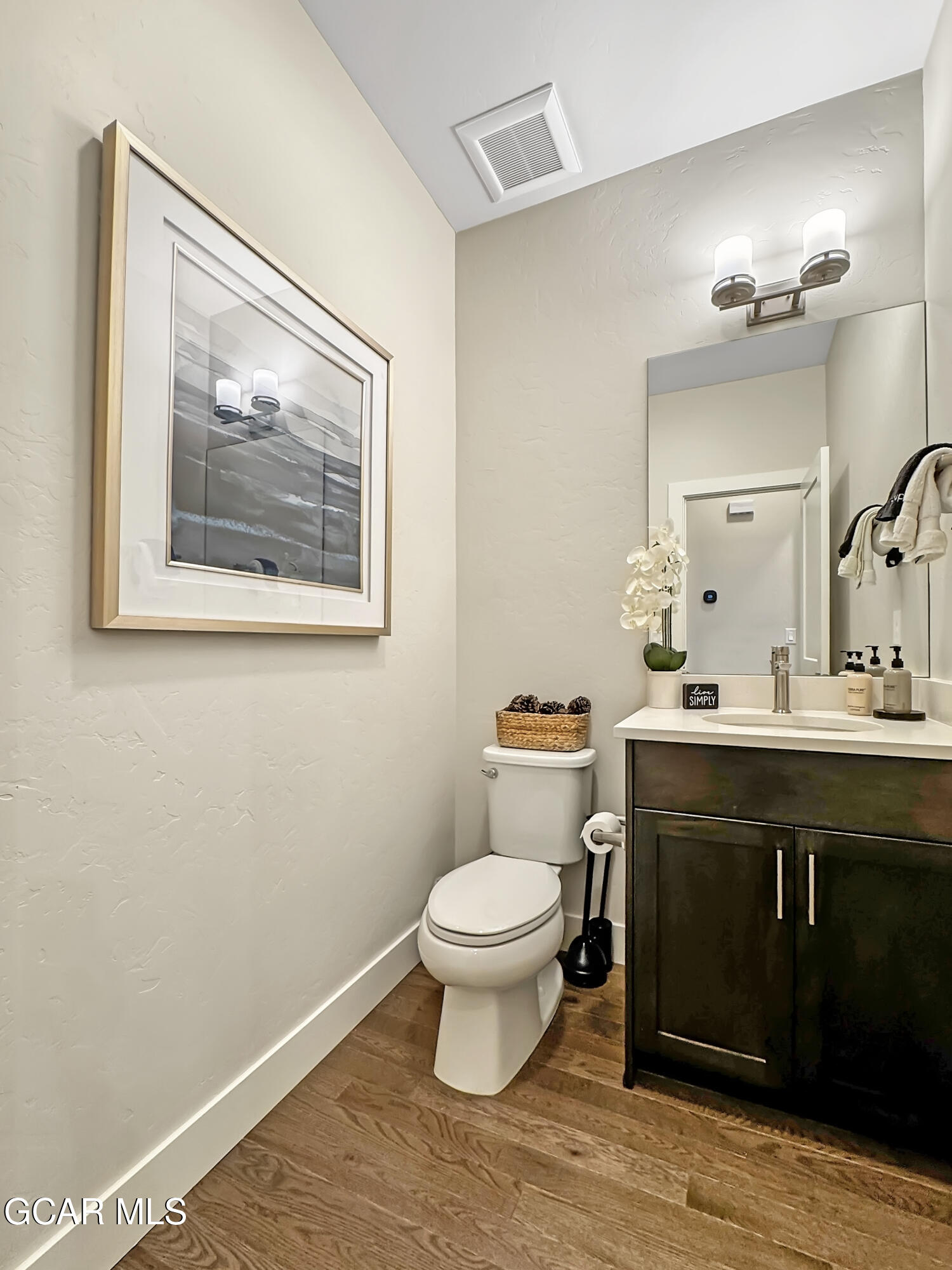 166 Homestead Loop Fraser, CO 80442 - Photo 26 of 56 a bathroom with a toilet sink and mirror