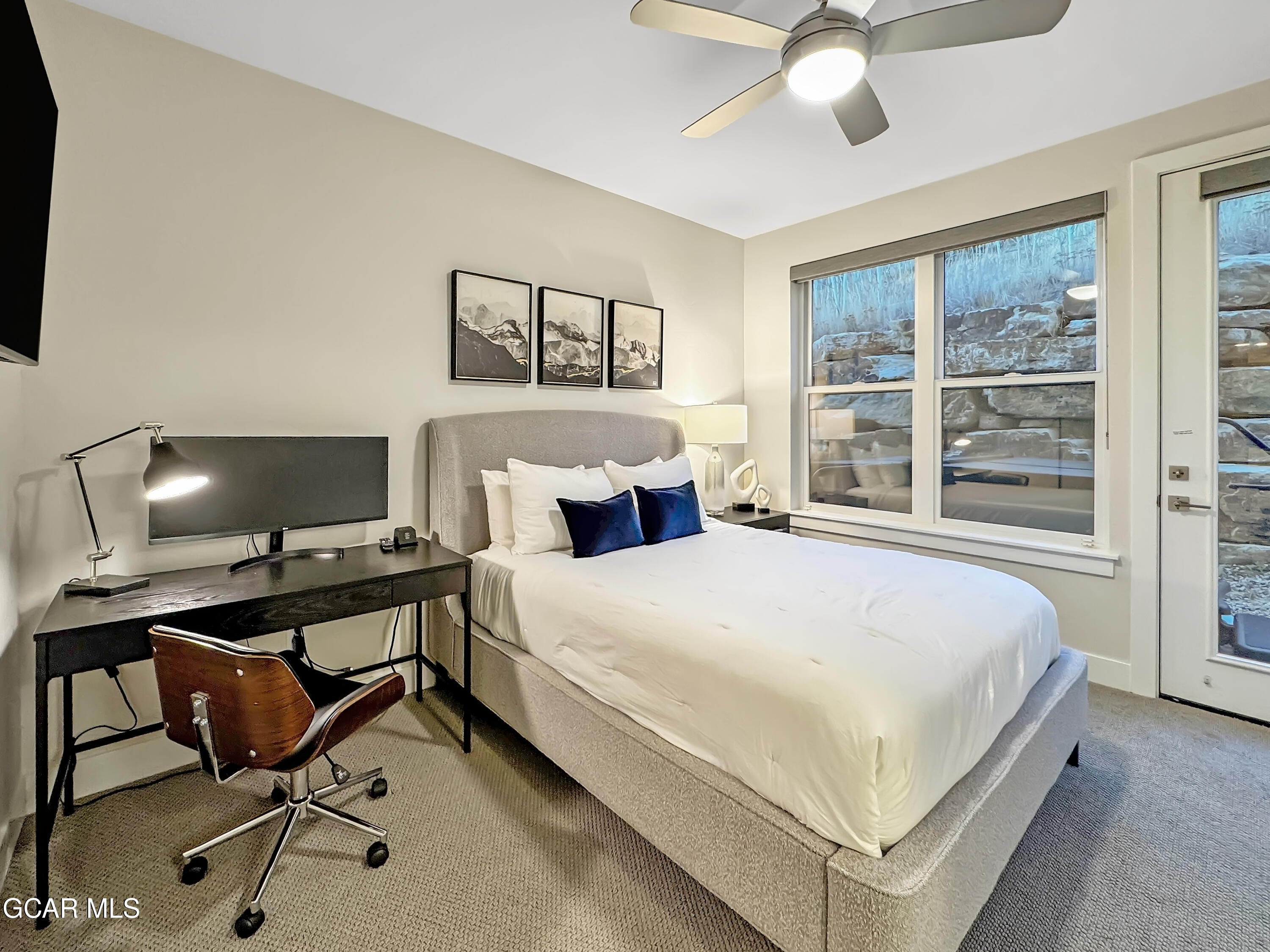 166 Homestead Loop Fraser, CO 80442 - Photo 27 of 56 a bedroom with a bed and a desk