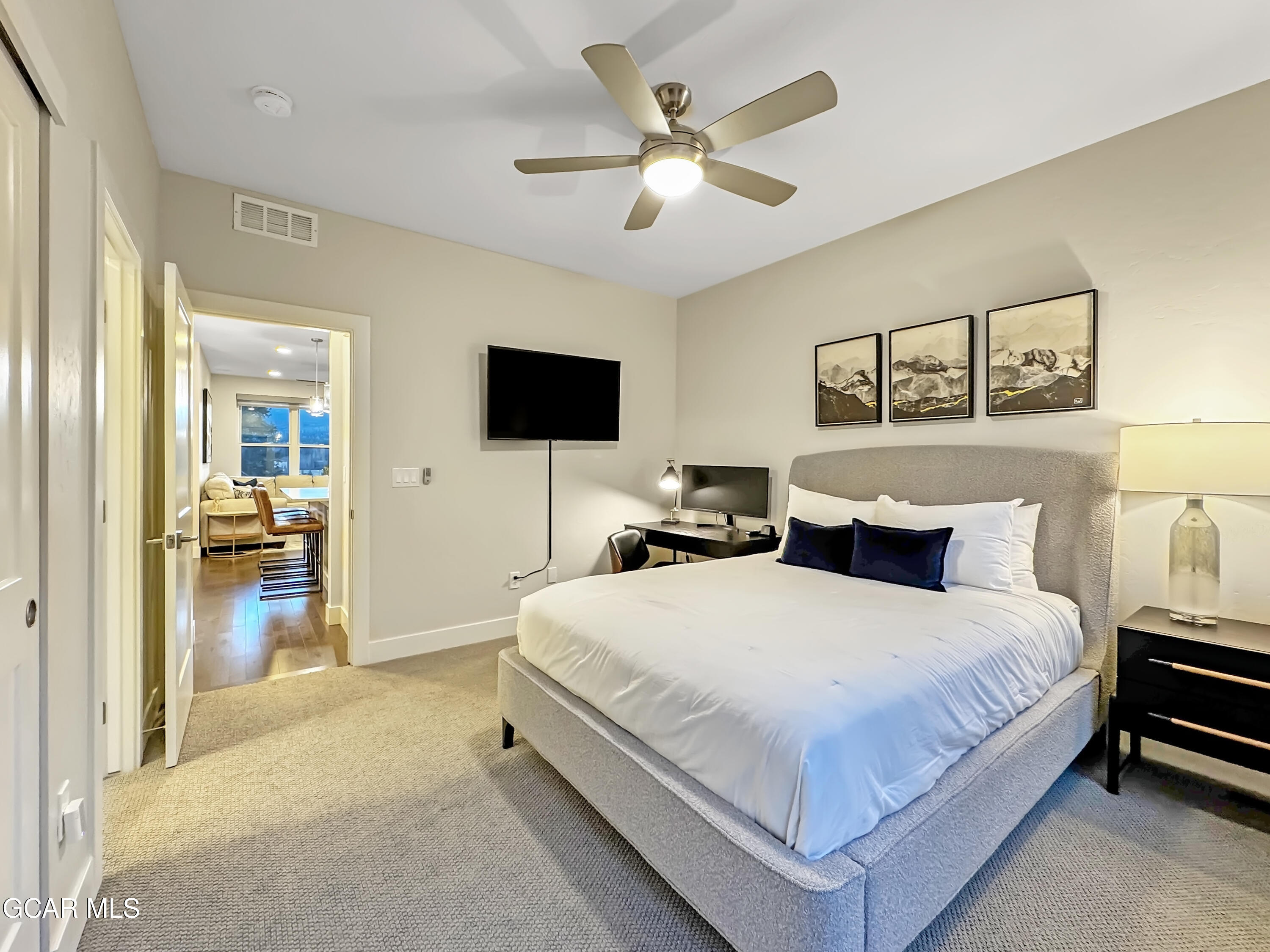 166 Homestead Loop Fraser, CO 80442 - Photo 31 of 56 a bedroom with a bed and a flat screen tv