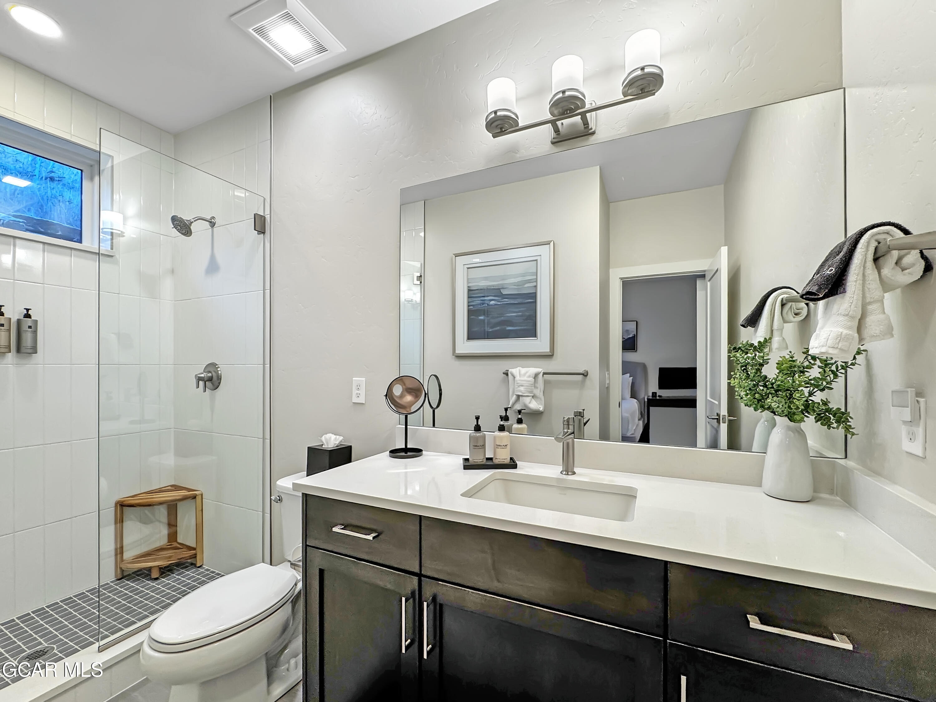 166 Homestead Loop Fraser, CO 80442 - Photo 32 of 56 a bathroom with a sink a toilet and shower
