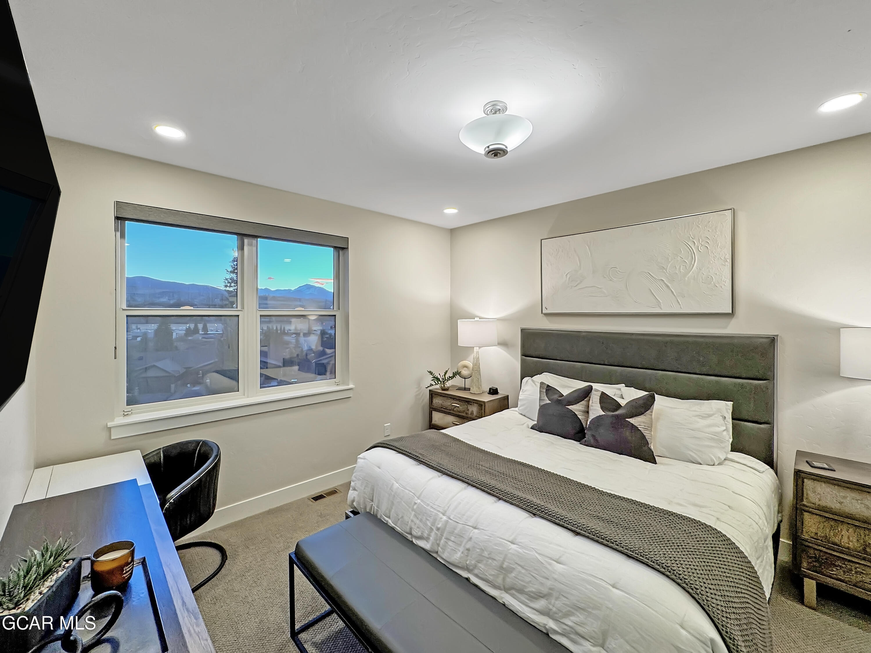 166 Homestead Loop Fraser, CO 80442 - Photo 39 of 56 a bedroom with a bed and a window