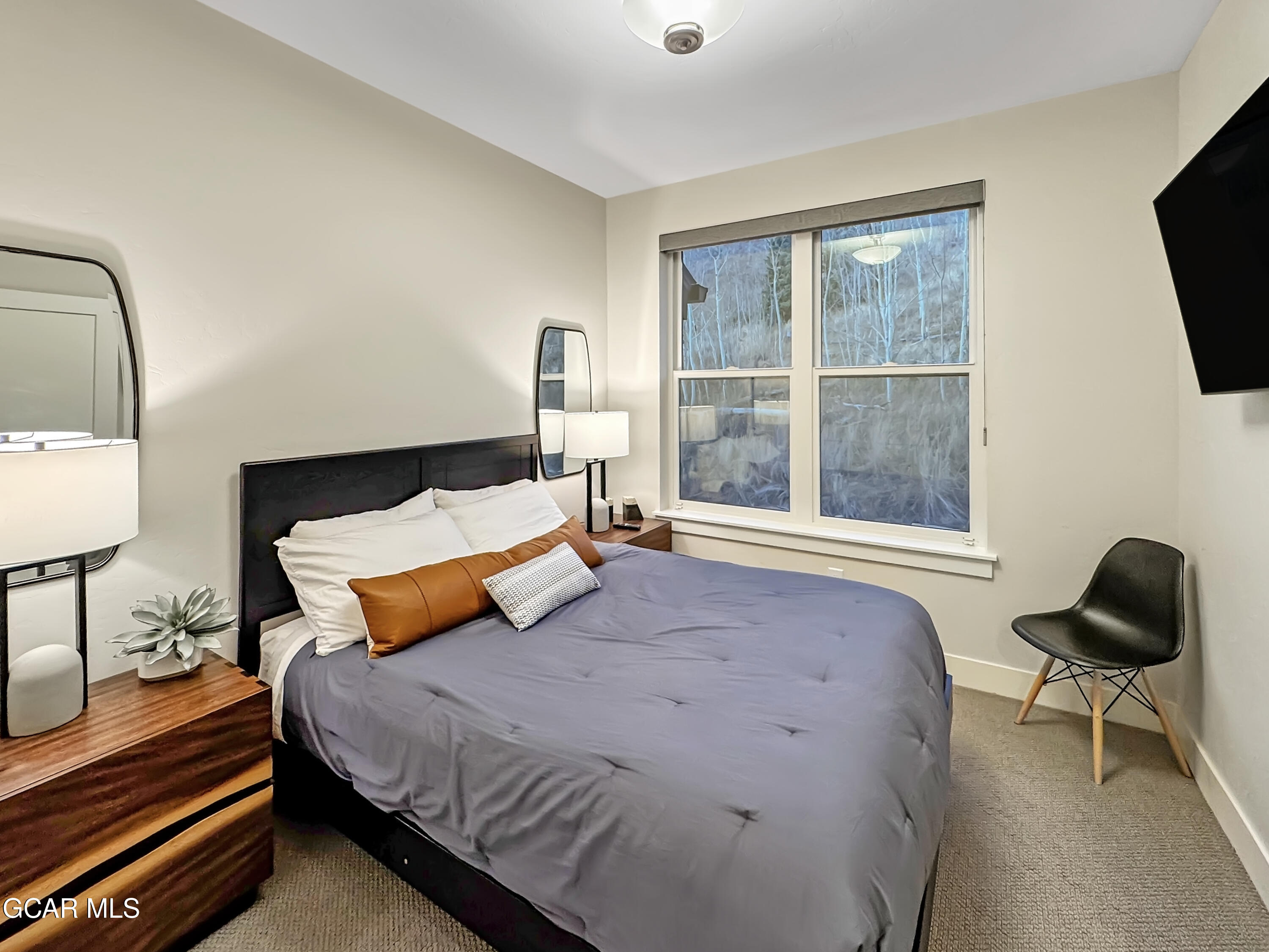 166 Homestead Loop Fraser, CO 80442 - Photo 48 of 56 a bedroom with a bed and a window