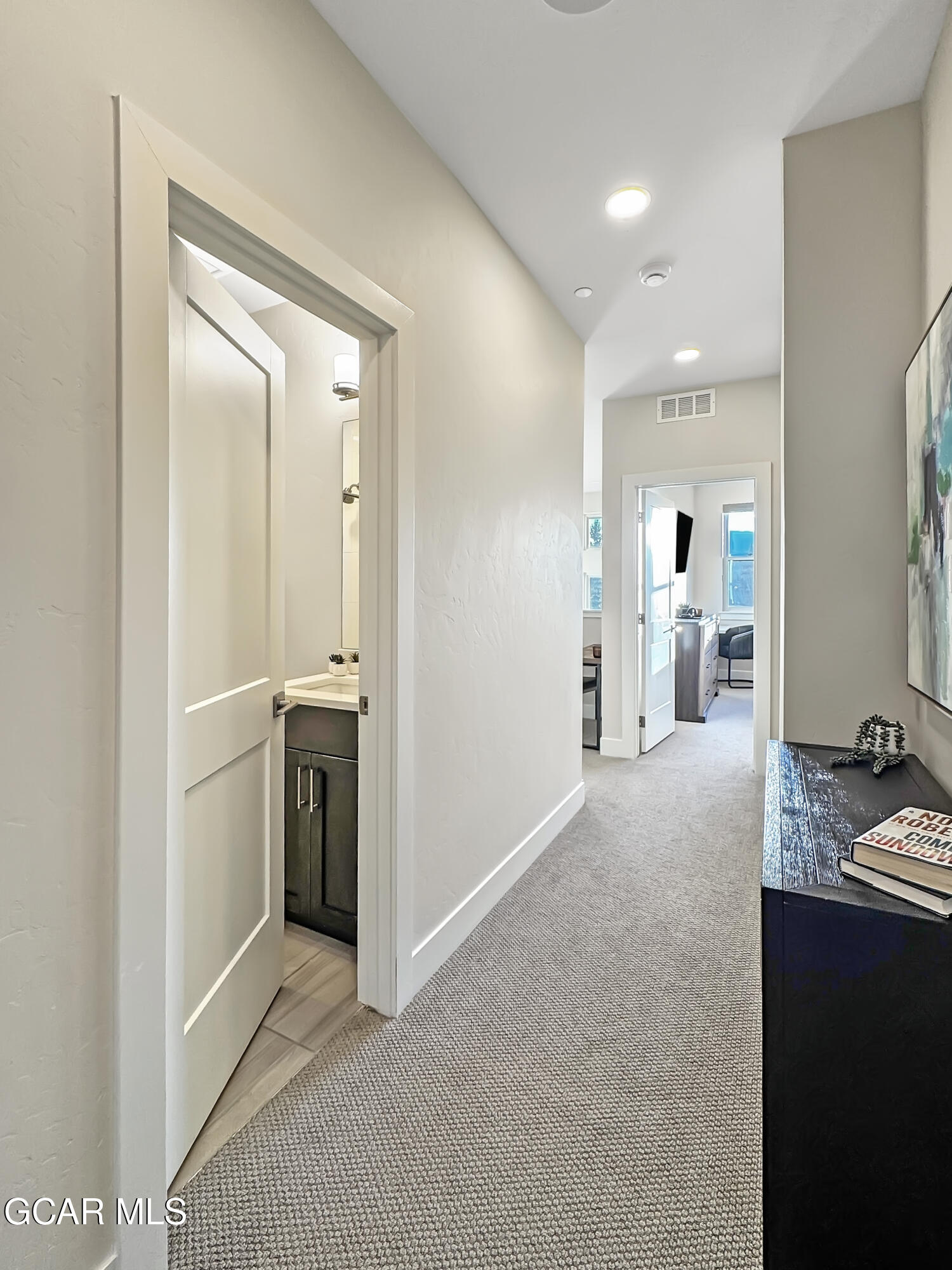 166 Homestead Loop Fraser, CO 80442 - Photo 51 of 56 a view of a hallway with bathroom and sink
