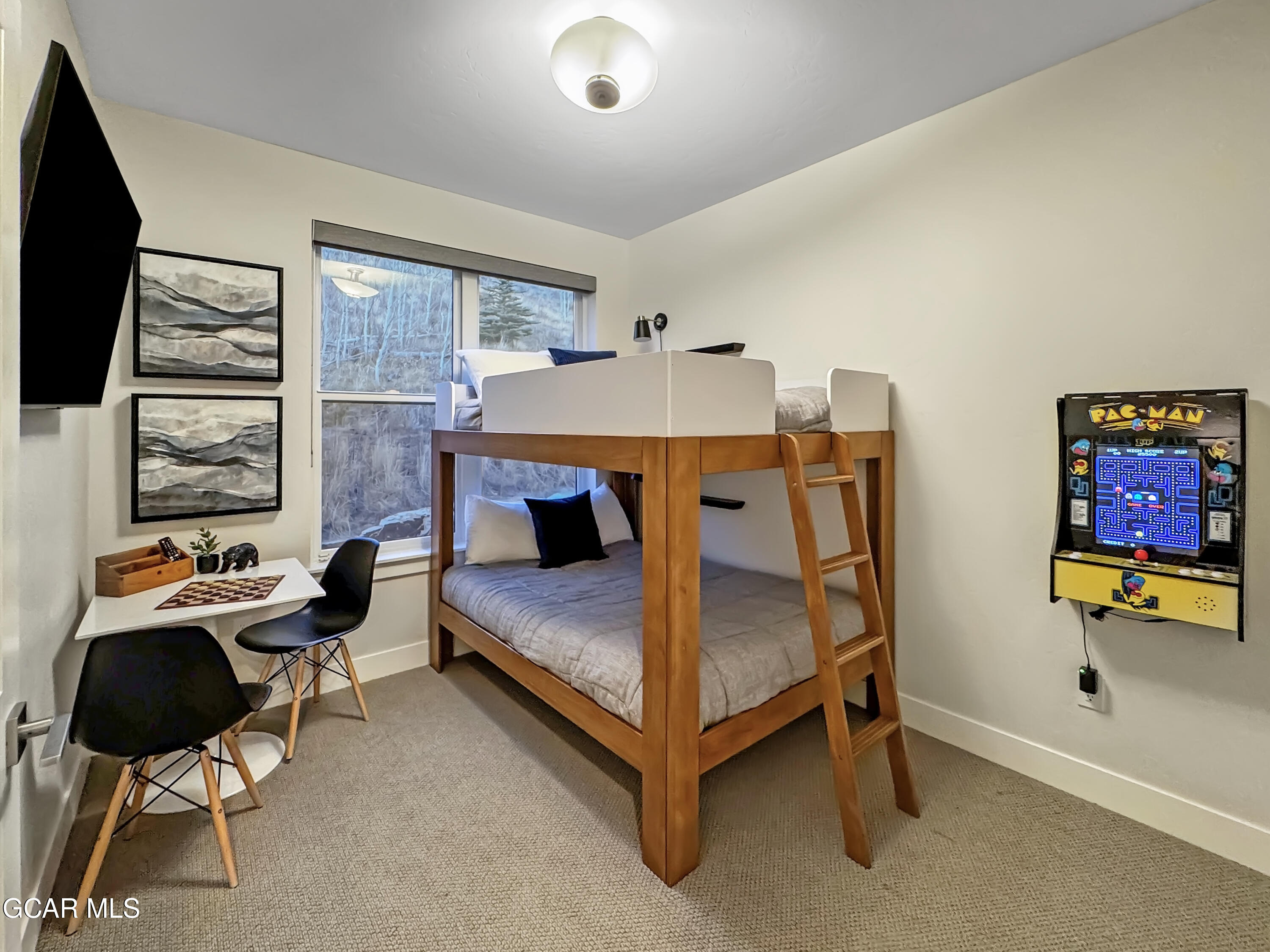 166 Homestead Loop Fraser, CO 80442 - Photo 53 of 56 a bedroom with furniture and a flat screen tv