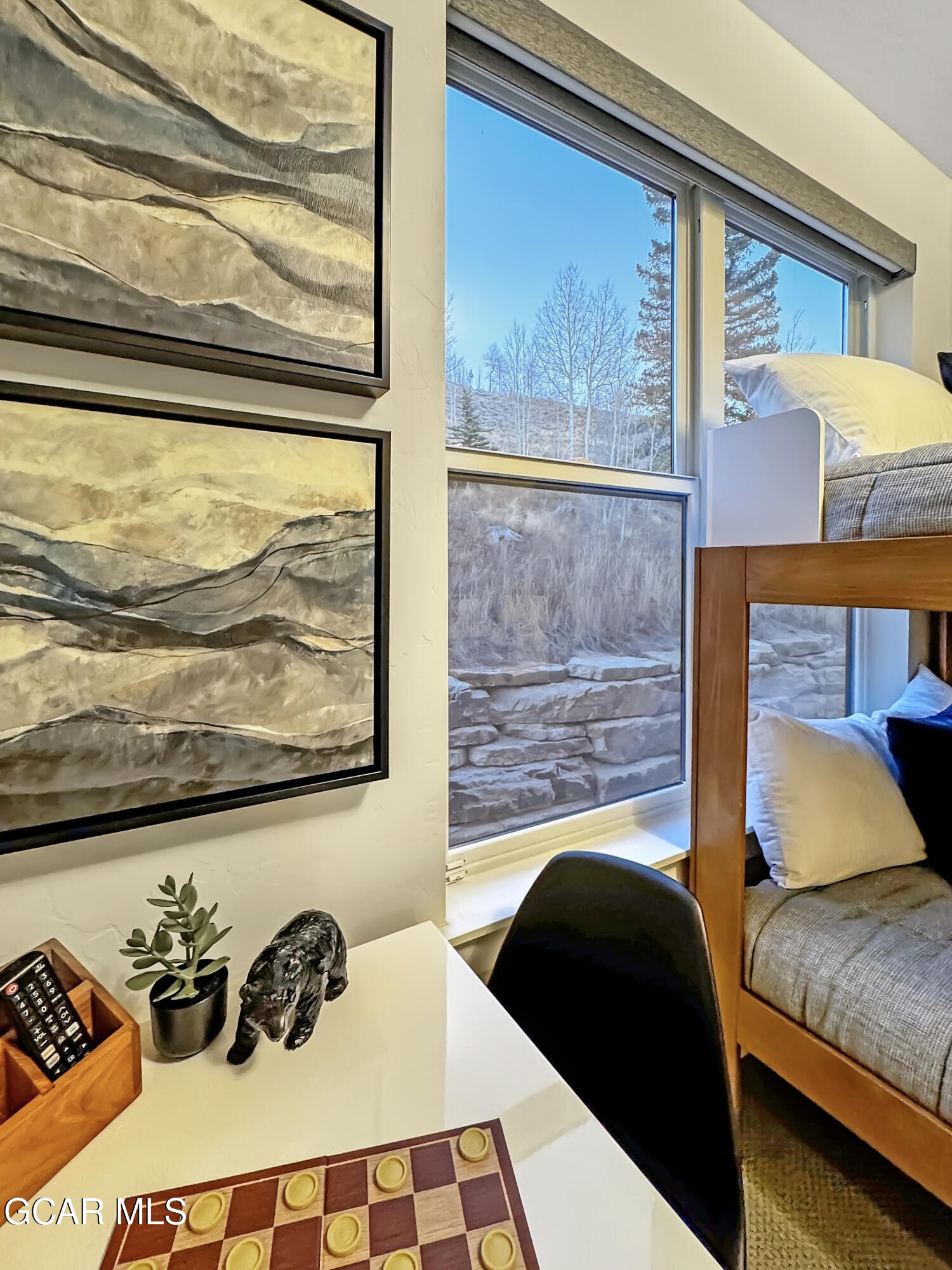 166 Homestead Loop Fraser, CO 80442 - Photo 54 of 56 a bedroom with a bed and wooden floor