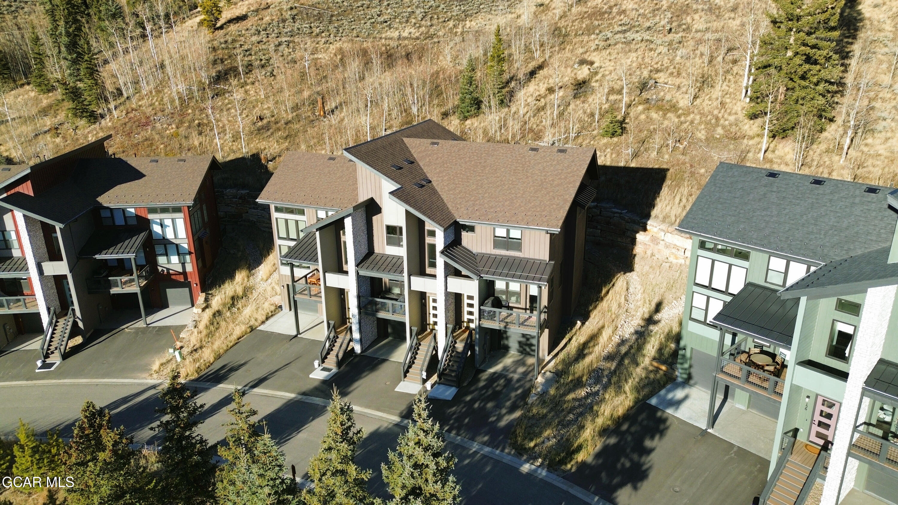 166 Homestead Loop Fraser, CO 80442 - Photo 55 of 56 an aerial view of a residential apartment building with a yard