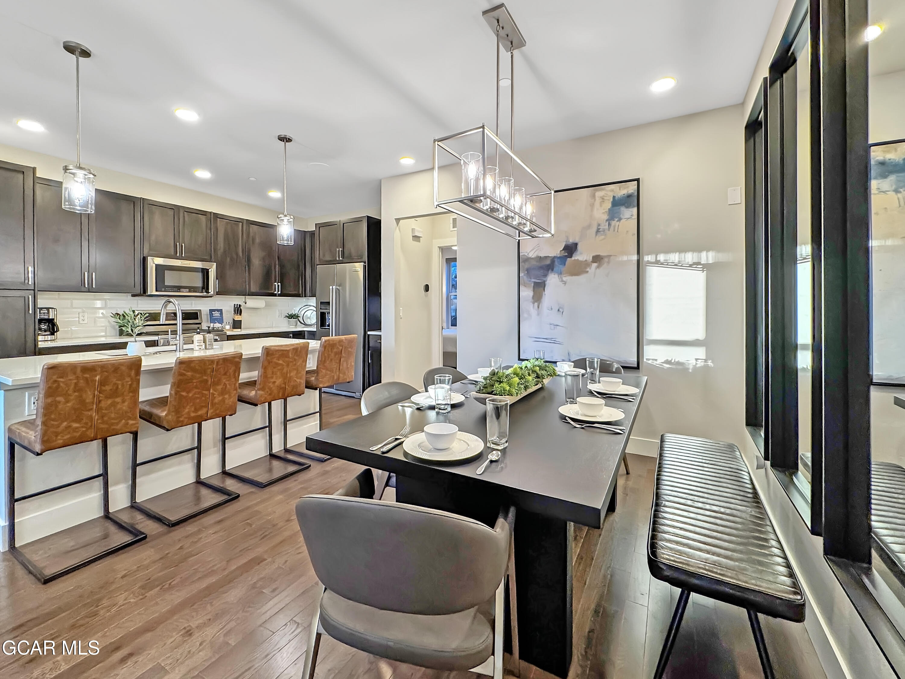 166 Homestead Loop Fraser, CO 80442 - Photo 7 of 56 a view of a dining room and livingroom with furniture wooden floor a chandelier