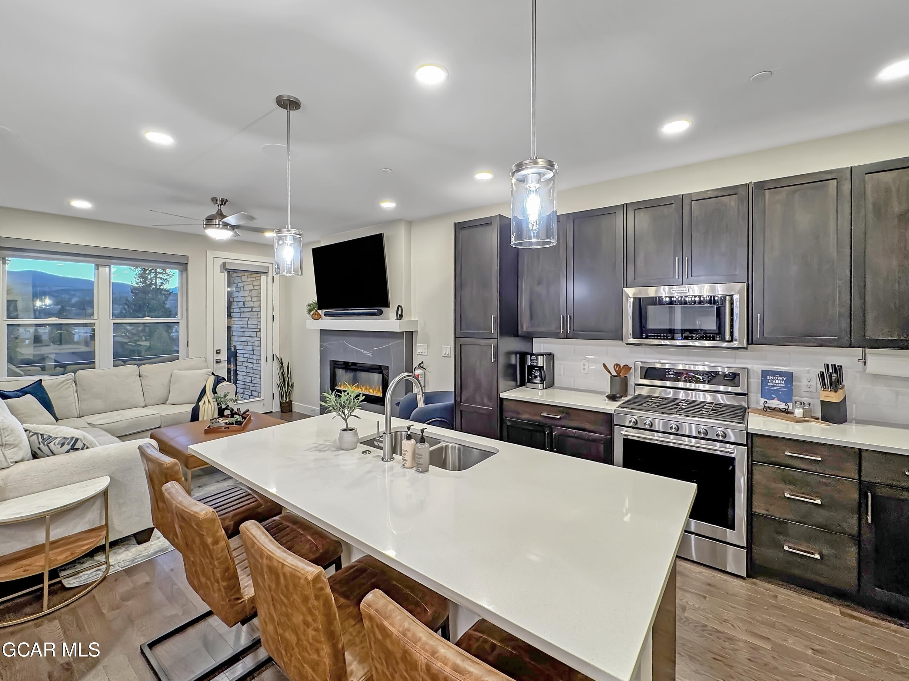 166 Homestead Loop Fraser, CO 80442 - Photo 8 of 56 a large kitchen with sink cabinets and stainless steel appliances