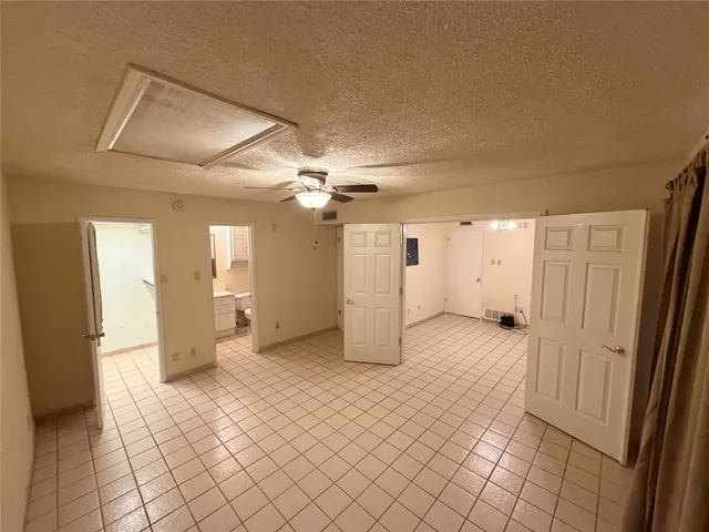 a view of a living room with furniture and a window