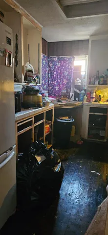 a kitchen with sink and cabinets