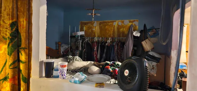 a view of a kitchen with a table and chairs