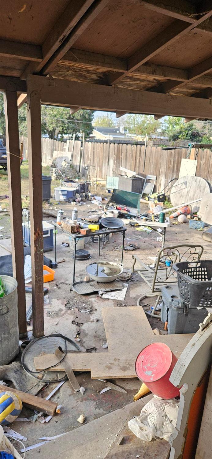 832 West 9th Street Merced, CA 95341 - Photo 15 of 44 a view of a kitchen with a table and chairs