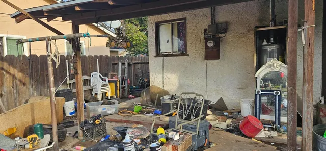 a bedroom with a bed and a cabinet