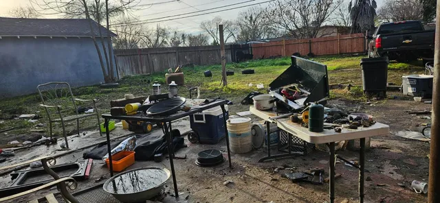 a roof deck with table and chairs