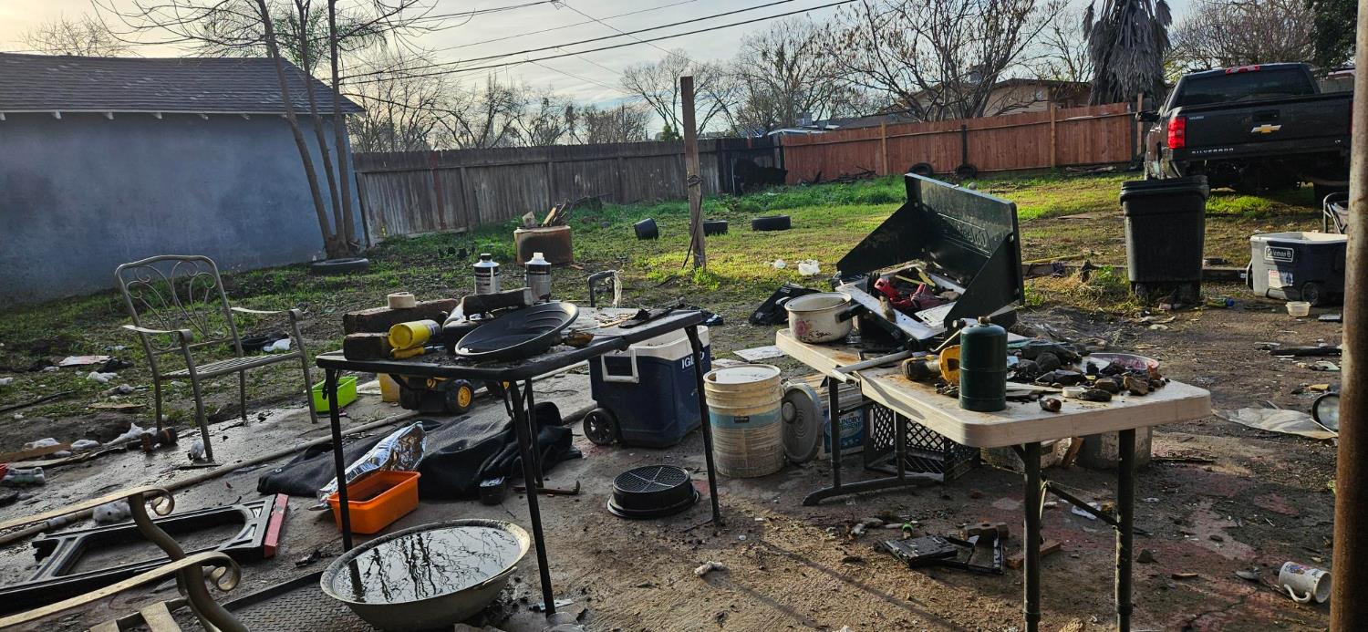 832 West 9th Street Merced, CA 95341 - Photo 21 of 44 a view of a chairs and table in backyard