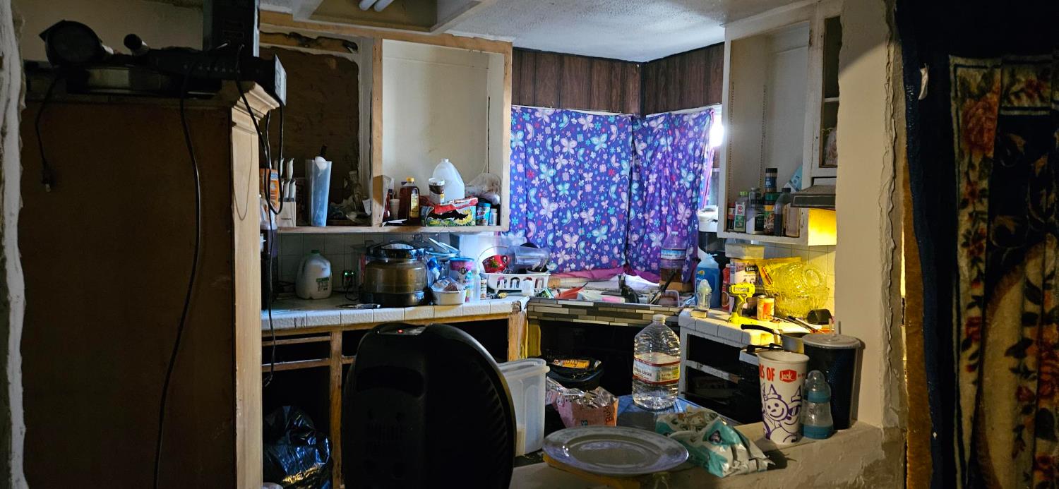832 West 9th Street Merced, CA 95341 - Photo 5 of 44 a view of walk in closet with clothes and shoes
