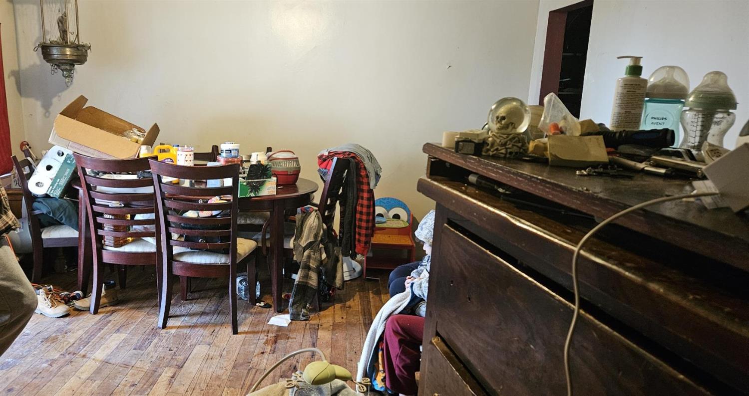 832 West 9th Street Merced, CA 95341 - Photo 6 of 44 a view of a dining room with furniture and wooden floor
