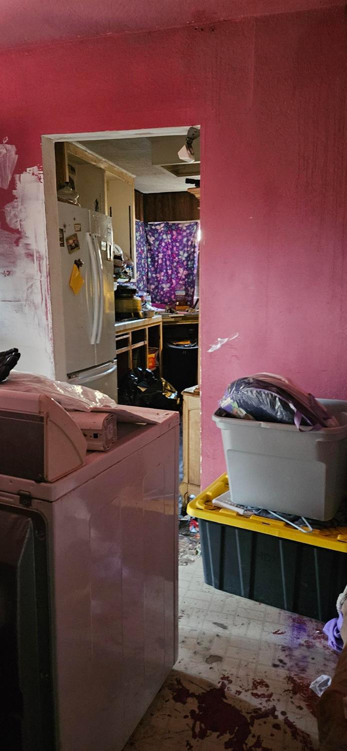 832 West 9th Street Merced, CA 95341 - Photo 10 of 44 a living room with furniture and a flat screen tv