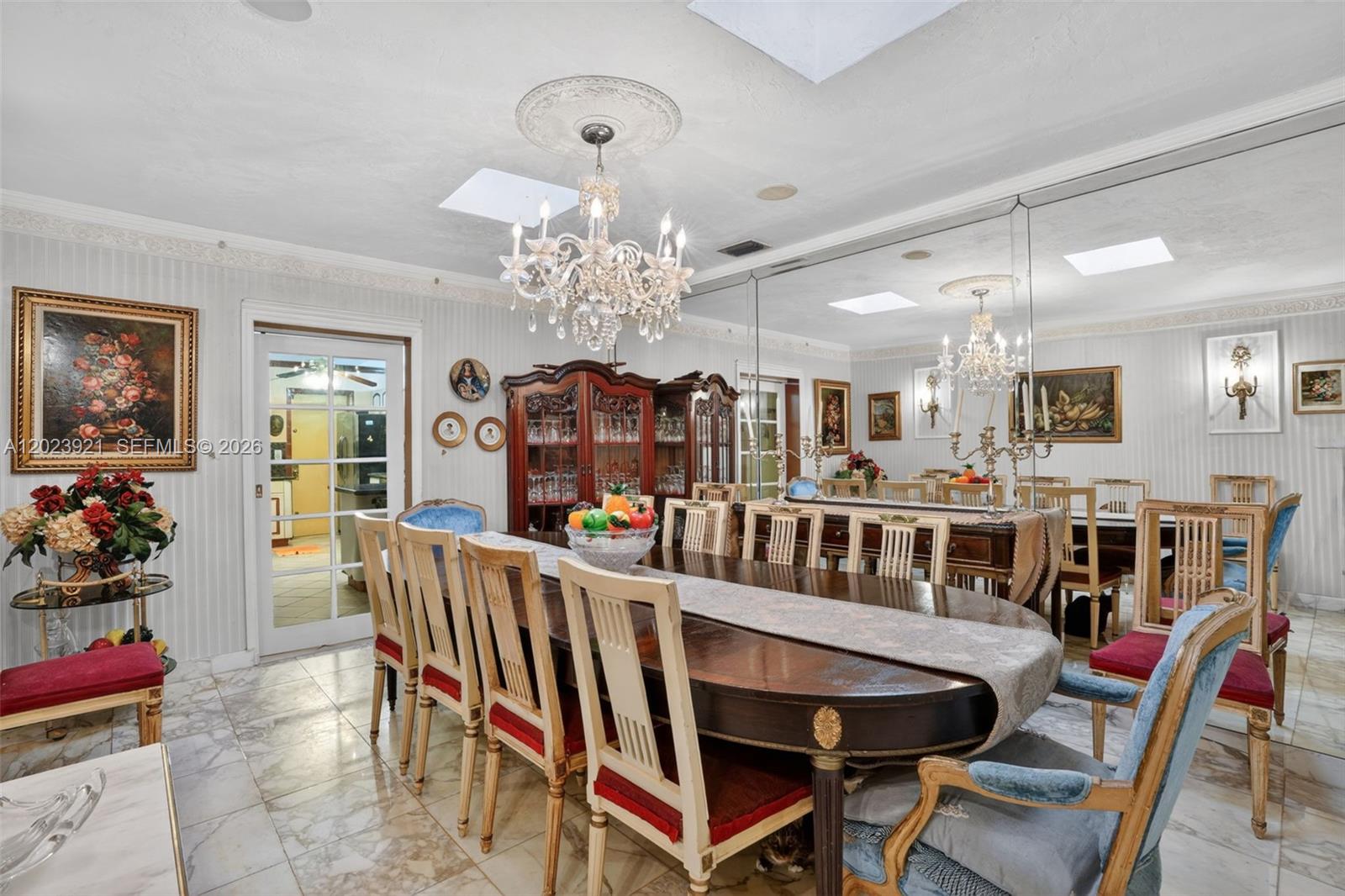 8461 Southwest 68th St Road Miami, FL 33143 - Photo 50 of 65 a view of a dining room with furniture and chandelier