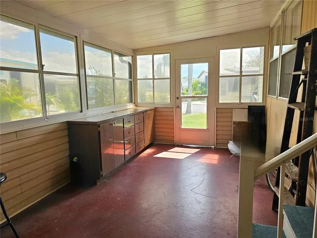 a view of a room with window hardwood floor