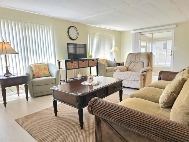 a living room with furniture and a table