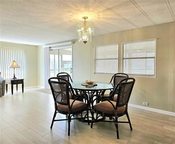 a view of a dining room with furniture and window