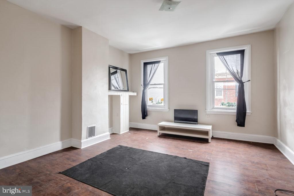2008 South 4th Street, Unit 2 Philadelphia, PA 19148 - Photo 3 of 7 a living room with furniture window and wooden floor
