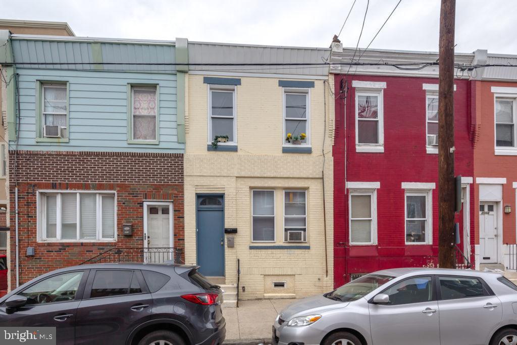2008 South 4th Street, Unit 2 Philadelphia, PA 19148 - Photo 7 of 7 a front view of a house with parking space and a car parked