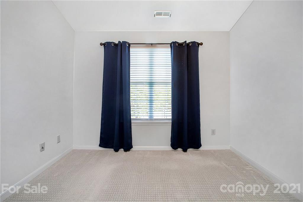 1104 Drummond Lane Matthews, NC 28104 - Photo 14 of 20 an empty room with windows and closet
