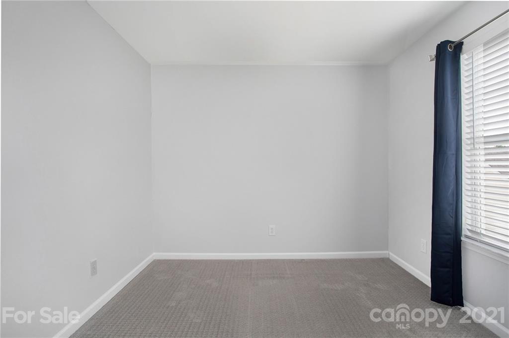 1104 Drummond Lane Matthews, NC 28104 - Photo 17 of 20 a view of an empty room and a window