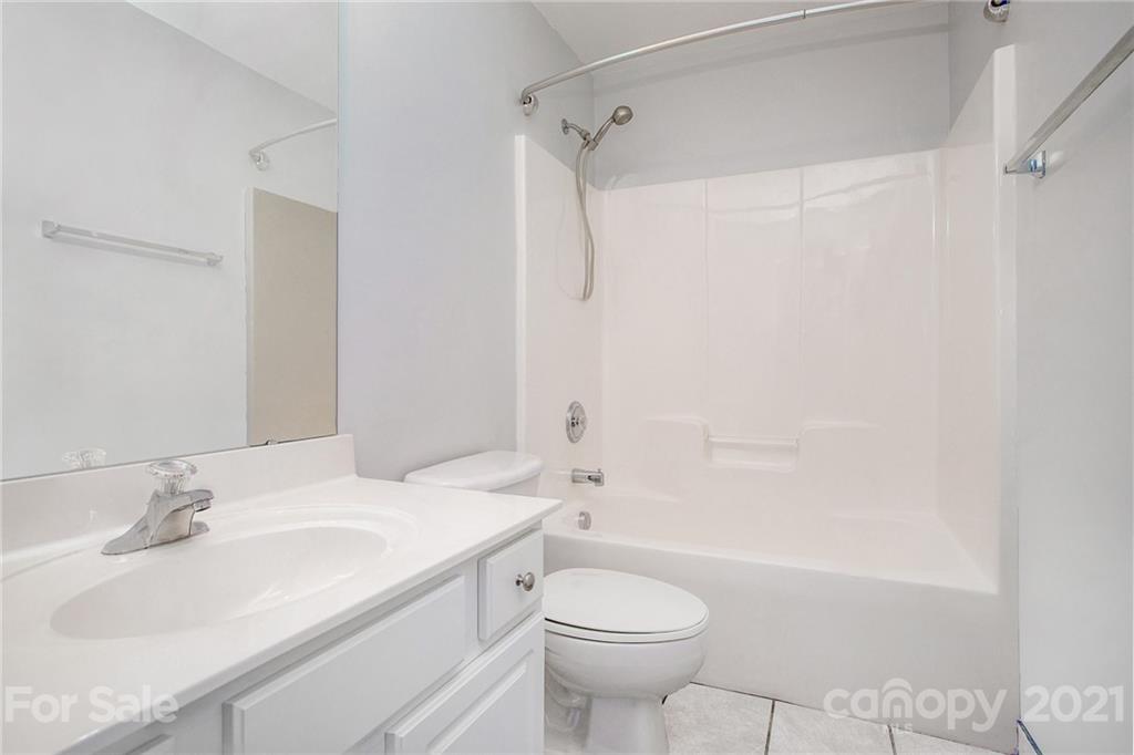 1104 Drummond Lane Matthews, NC 28104 - Photo 7 of 20 a bathroom with a sink toilet and shower