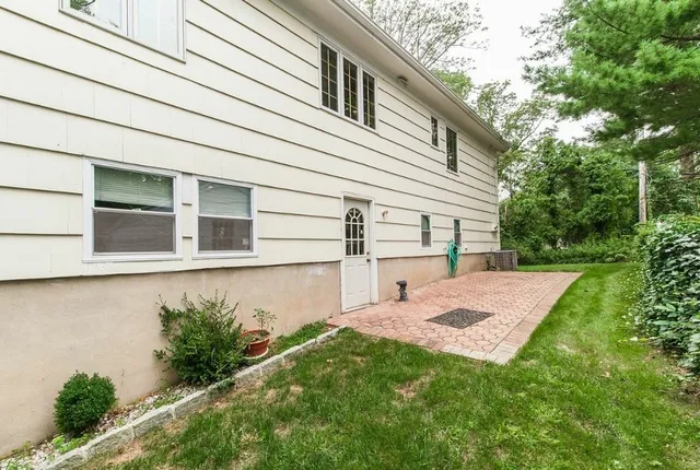 a backyard of a house with lots of green space