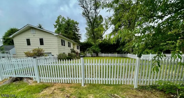 a view of a house with a small yard
