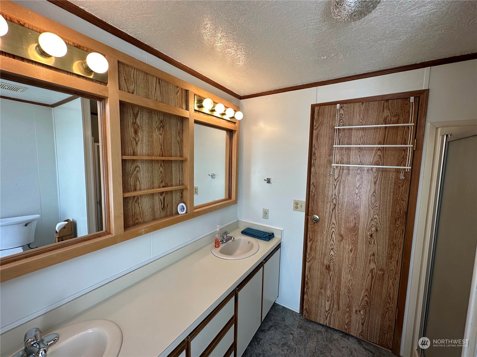2283 Rincon Avenue, Unit 92 Enumclaw, WA 98022 - Photo 16 of 25 a bathroom with a sink and a mirror