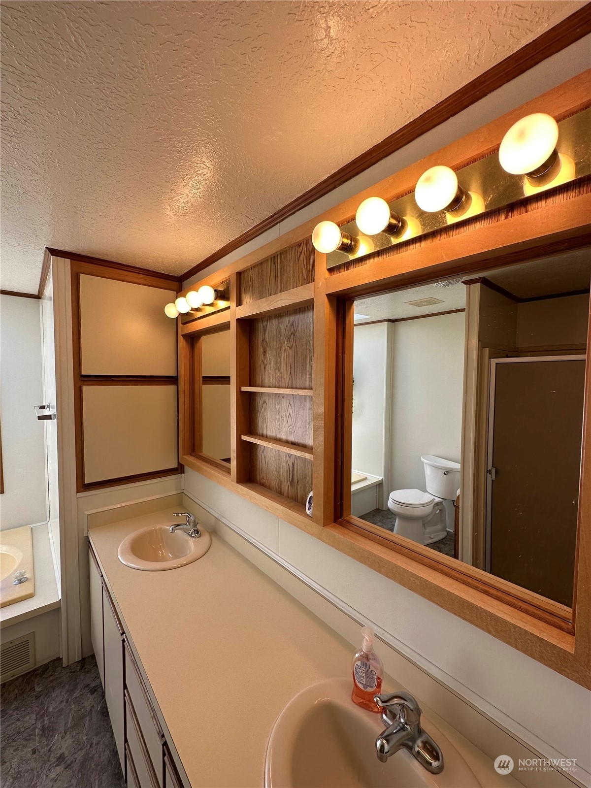 2283 Rincon Avenue, Unit 92 Enumclaw, WA 98022 - Photo 17 of 25 a bathroom with a sink and a mirror