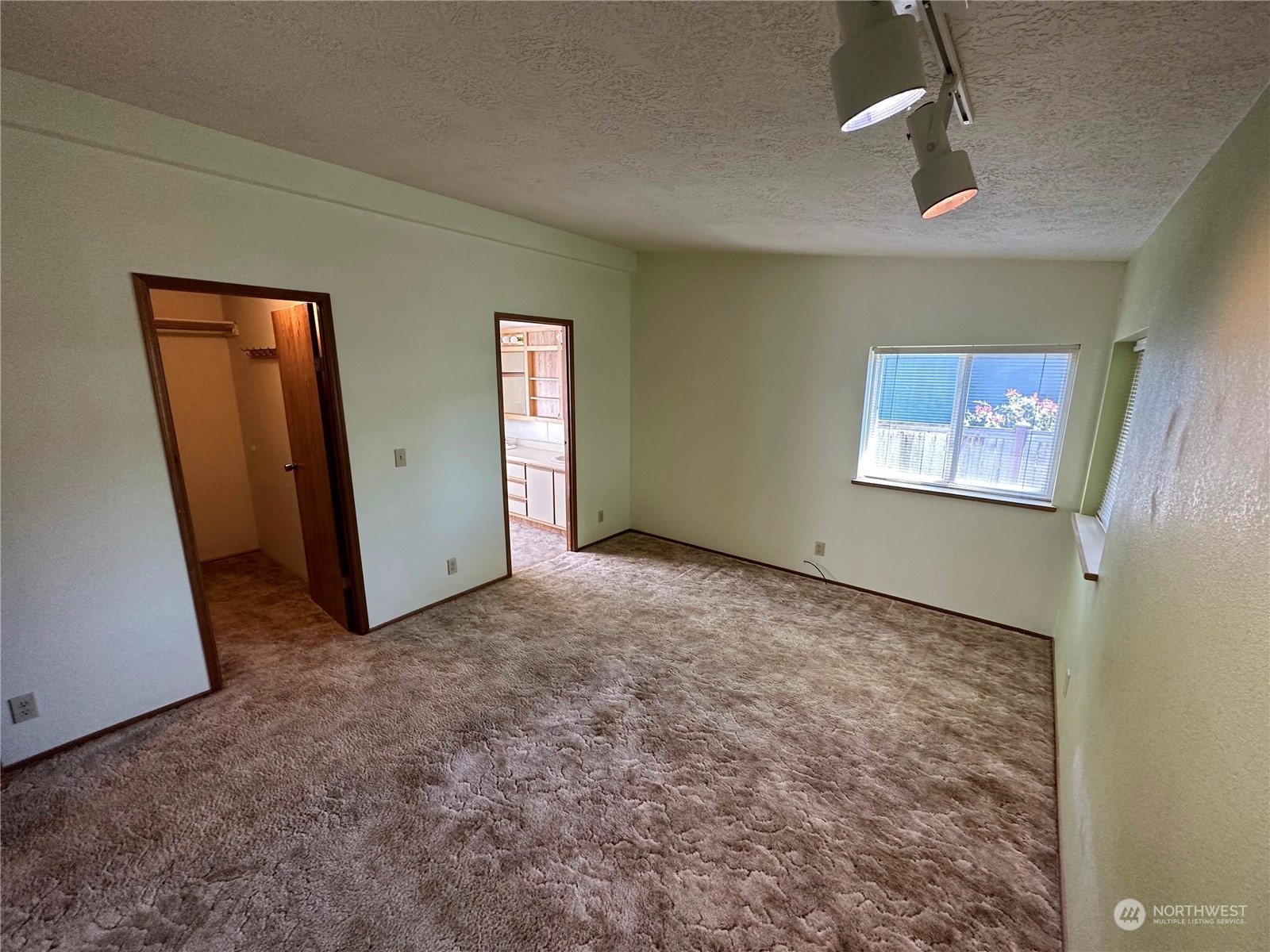 2283 Rincon Avenue, Unit 92 Enumclaw, WA 98022 - Photo 22 of 25 an empty room with windows