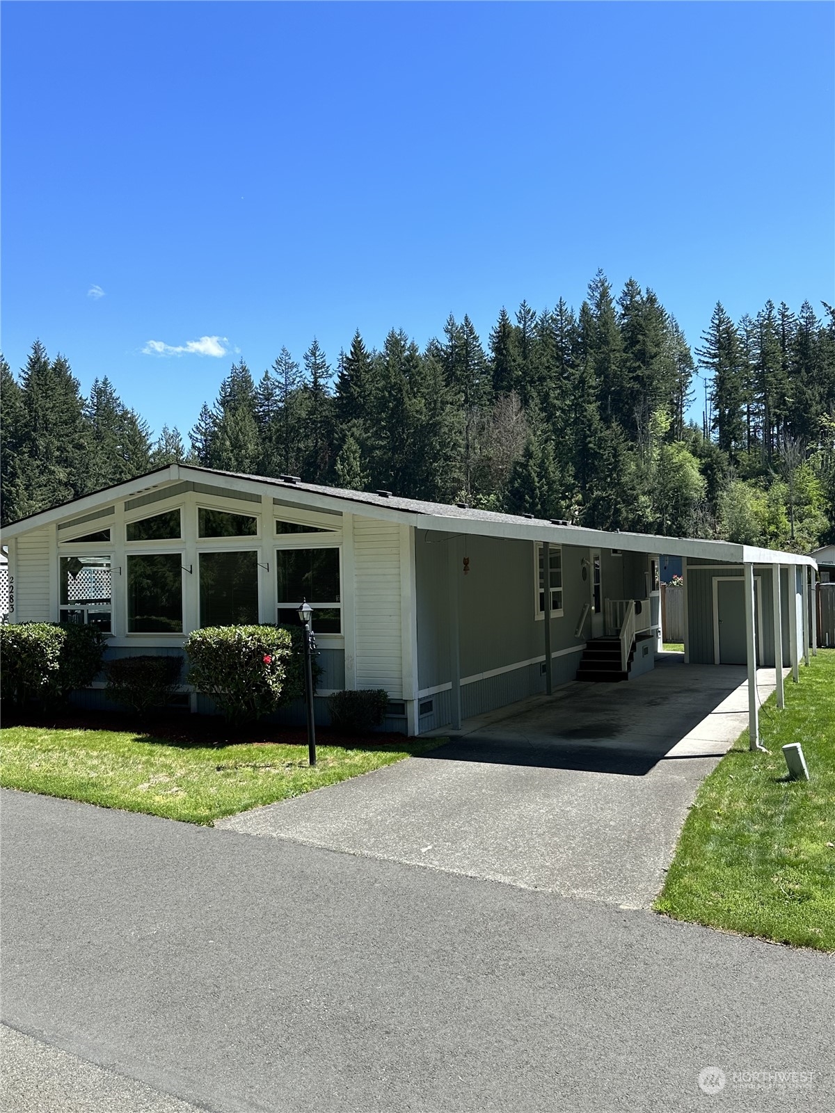 2283 Rincon Avenue, Unit 92 Enumclaw, WA 98022 - Photo 4 of 25 a view of a house with a yard