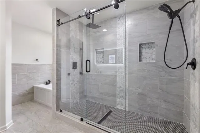 a bathroom with a glass shower door