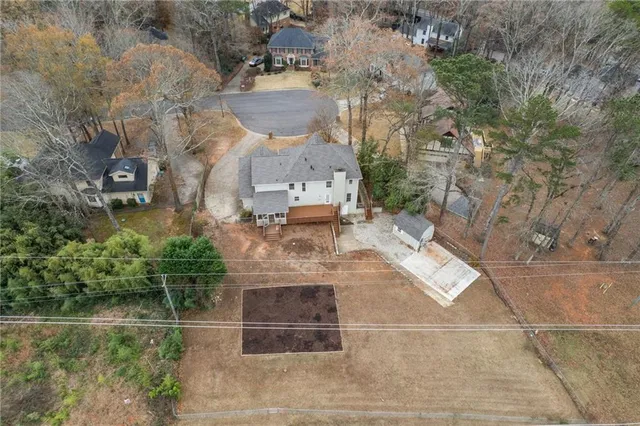 an aerial view of a house with outdoor space
