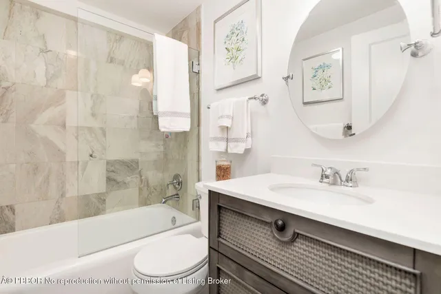 a bathroom with a sink a toilet and a bathtub