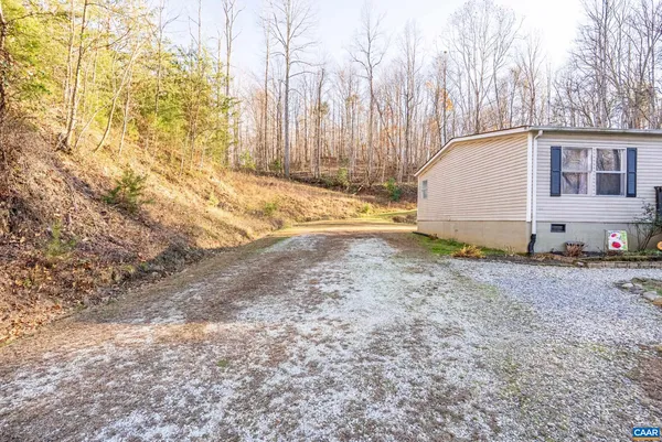 a view of a backyard of the house