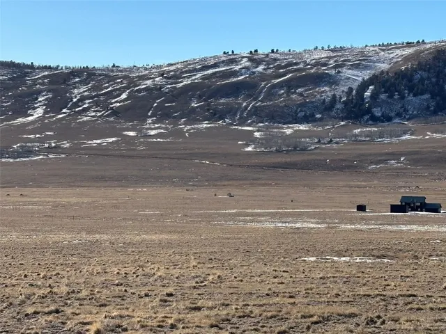a view of a large body of water and mountain