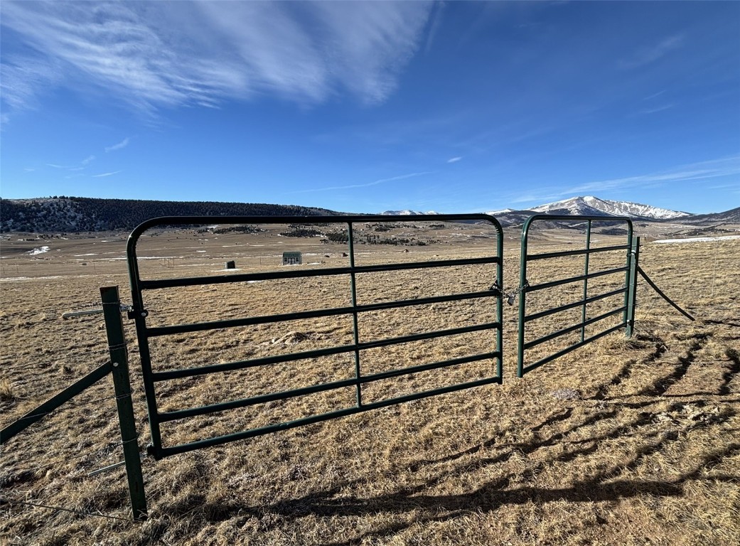 2716 Gap Road Fairplay, CO 80440 - Photo 4 of 17 a view of a dry yard with wooden fence