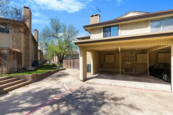 a view of a house with a yard and garage