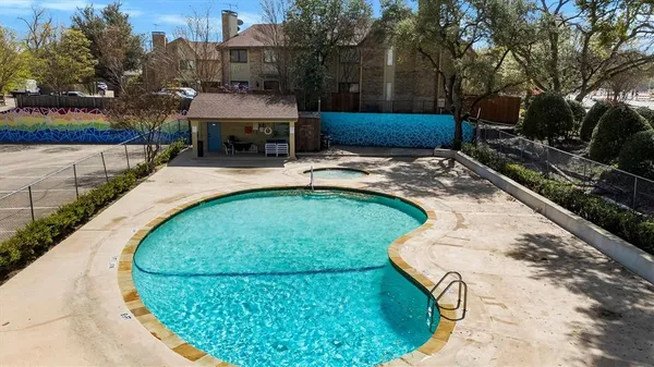 a view of a swimming pool with a patio